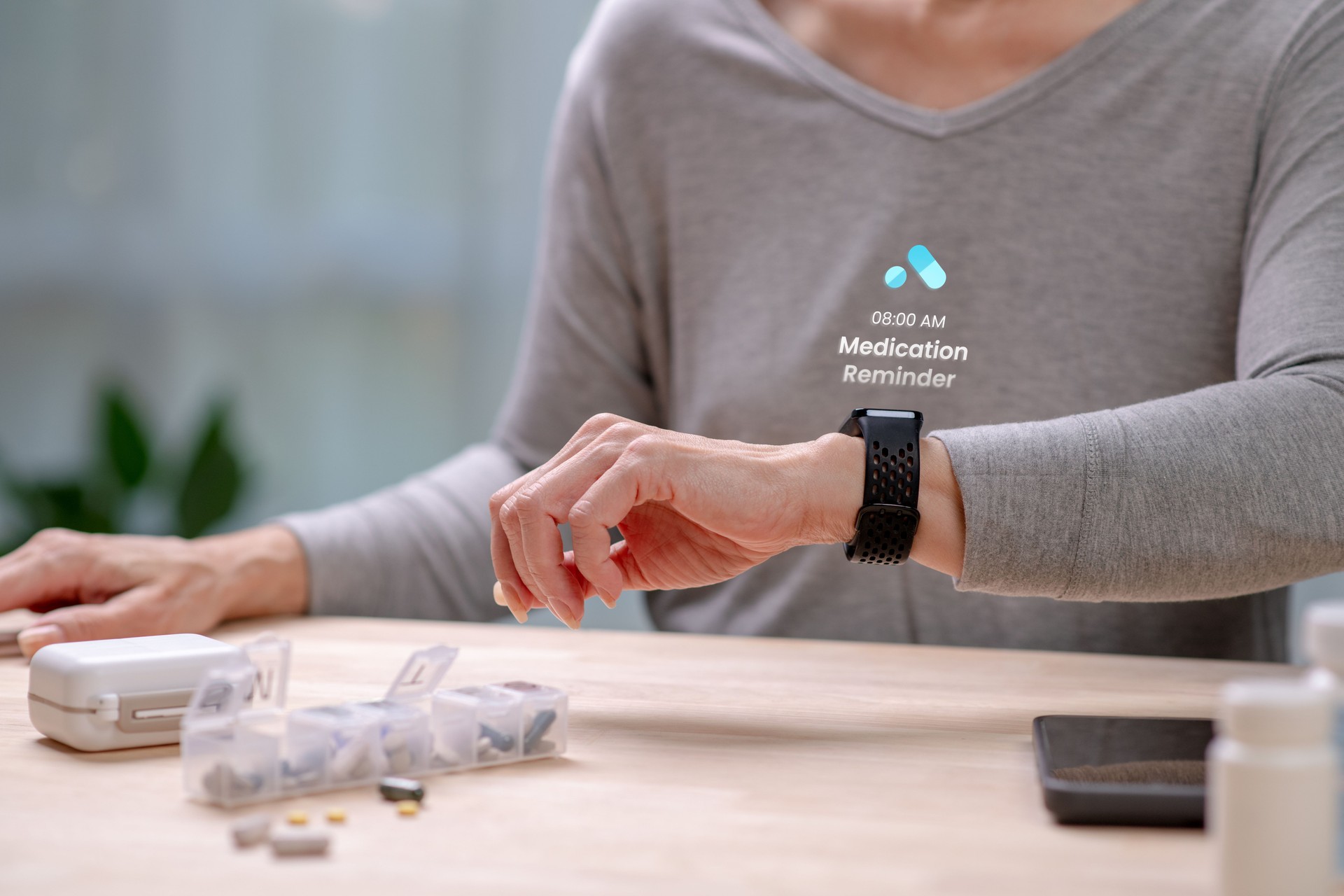 Senior Asian Woman checking medication reminder on smartwatches , in concept of Augmented reality, Application Interface design, UX UI design, and Health care